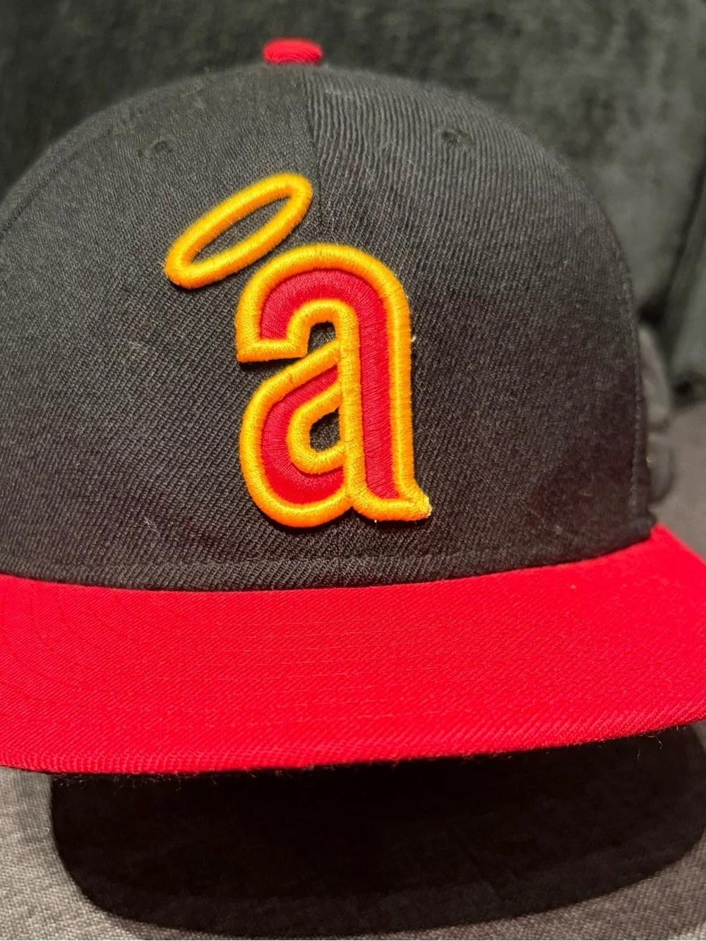 New Era Black Cap with Red Brim and Yellow Logo